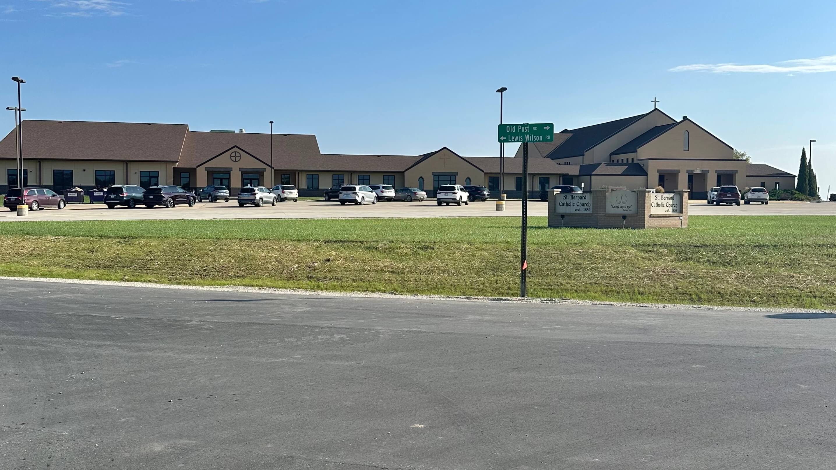 St. Bernard Catholic Church in Wamego with newly paved roadway in the foreground